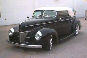 <1940 Ford Convertible street rod with a carson top>
