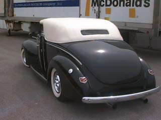 <1940 Ford Convertible street rod with a carson top>