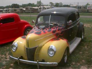 <flamed 1940 Ford sedan>