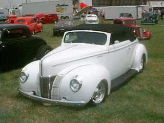 <1940 Ford Convertible street rod with a carson top>