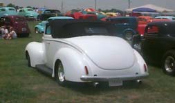 <1940 Ford Convertible street rod with a carson top>